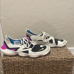 Nike White and Black Athletic Shoes with Pink and Blue Accents